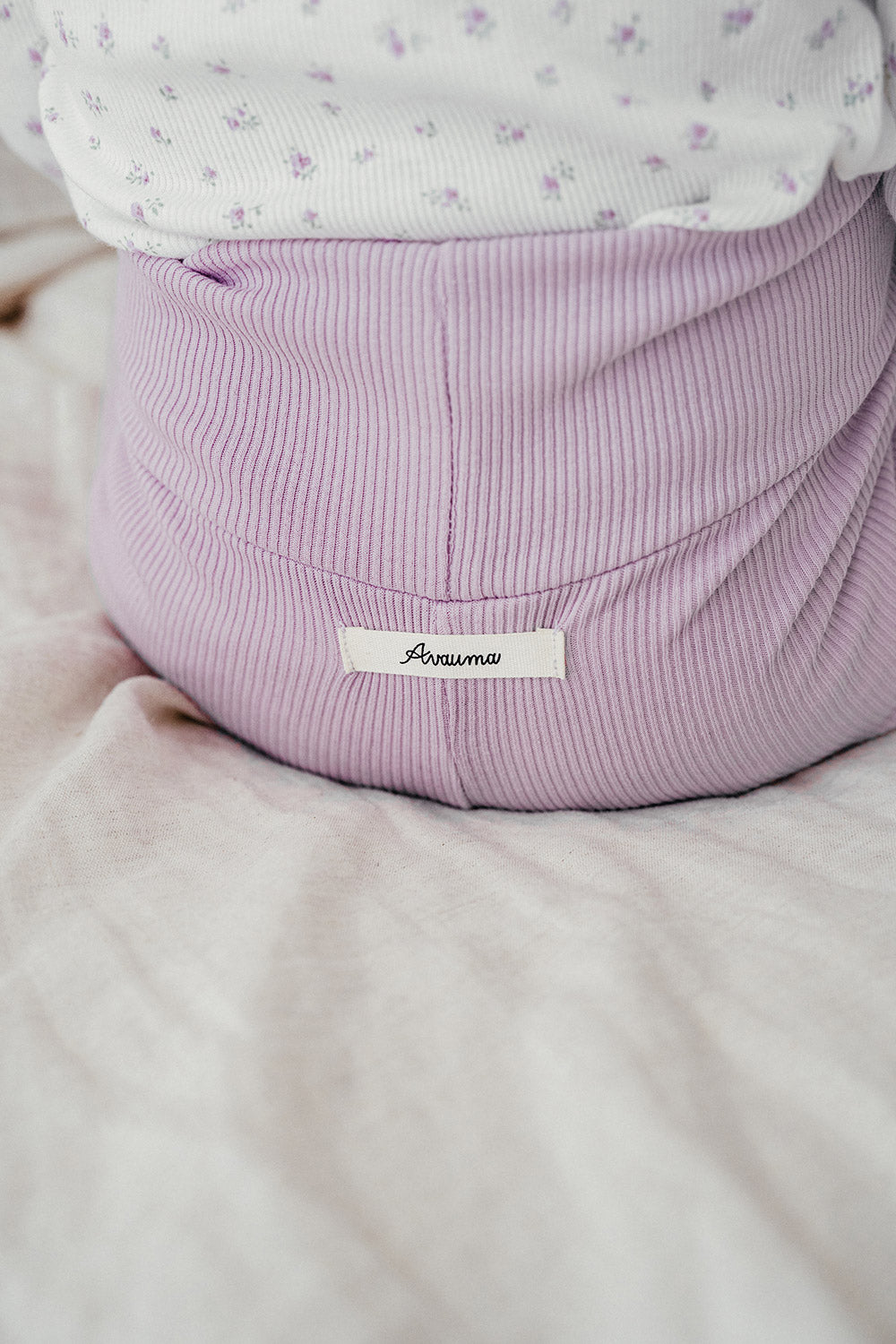 Close-up of Avauma Aileen Baby Leggings - Cream Purple, soft ribbed fabric, high-waist design for infant comfort Close-up of Avauma Aileen Baby Leggings - Cream Purple, soft ribbed fabric, high-waist design for infant comfort