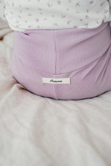 Close-up of Avauma Aileen Baby Leggings - Cream Purple, soft ribbed fabric, high-waist design for infant comfort Close-up of Avauma Aileen Baby Leggings - Cream Purple, soft ribbed fabric, high-waist design for infant comfort