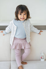 Baby girl wearing Avauma Aileen Bloom Cardigan in Lunabel Navy – soft and cozy floral cardigan for toddlers, featuring navy blue trim. Baby girl wearing Avauma Aileen Bloom Cardigan in Lunabel Navy – soft and cozy floral cardigan for toddlers, featuring navy blue trim.