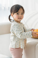 Close-up of Avauma Aileen Bloom Cardigan in Milk Flower, delicate floral knit baby cardigan, cozy and stylish for toddlers. Close-up of Avauma Aileen Bloom Cardigan in Milk Flower, delicate floral knit baby cardigan, cozy and stylish for toddlers.