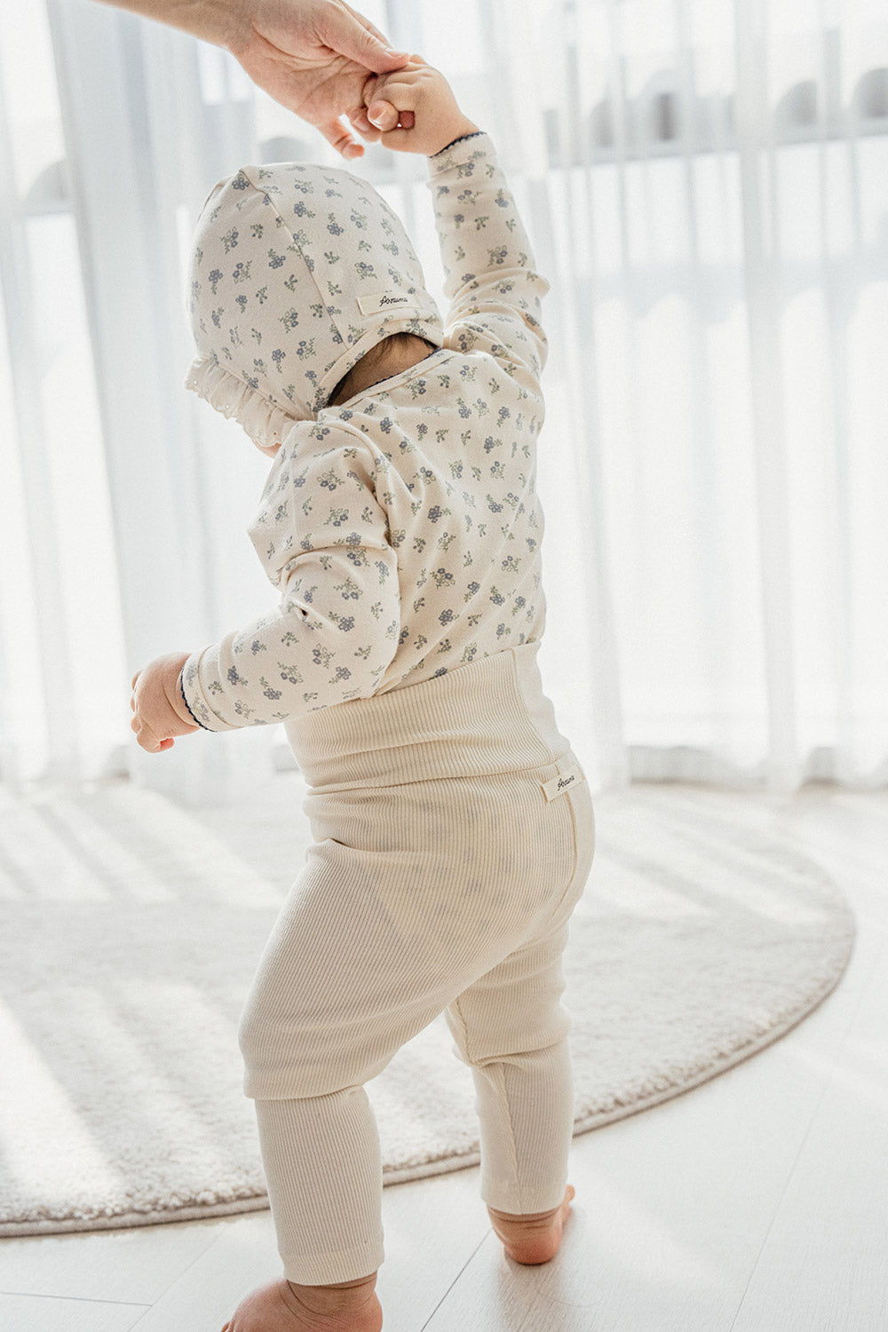 Back view of the Avauma Cream Bodysuit in Spring Forest print – demonstrating a cozy, stretchy fit and durable stitching for fuss-free dressing and all-day infant comfort. Back view of the Avauma Cream Bodysuit in Spring Forest print – demonstrating a cozy, stretchy fit and durable stitching for fuss-free dressing and all-day infant comfort.