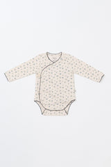 Front view of the Avauma Cream Bodysuit in Spring Forest print – a long-sleeve, soft cotton baby bodysuit featuring a delicate floral pattern for newborns and infants.
 Front view of the Avauma Cream Bodysuit in Spring Forest print – a long-sleeve, soft cotton baby bodysuit featuring a delicate floral pattern for newborns and infants.