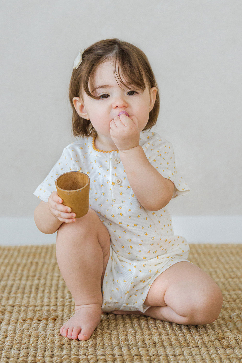 AVAUMA toddler girl smiling in lemon butter floral summer pajama set AVAUMA toddler girl smiling in lemon butter floral summer pajama set