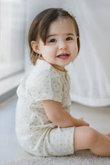 AVAUMA toddler girl smiling in lemon butter floral summer pajama set AVAUMA toddler girl smiling in lemon butter floral summer pajama set