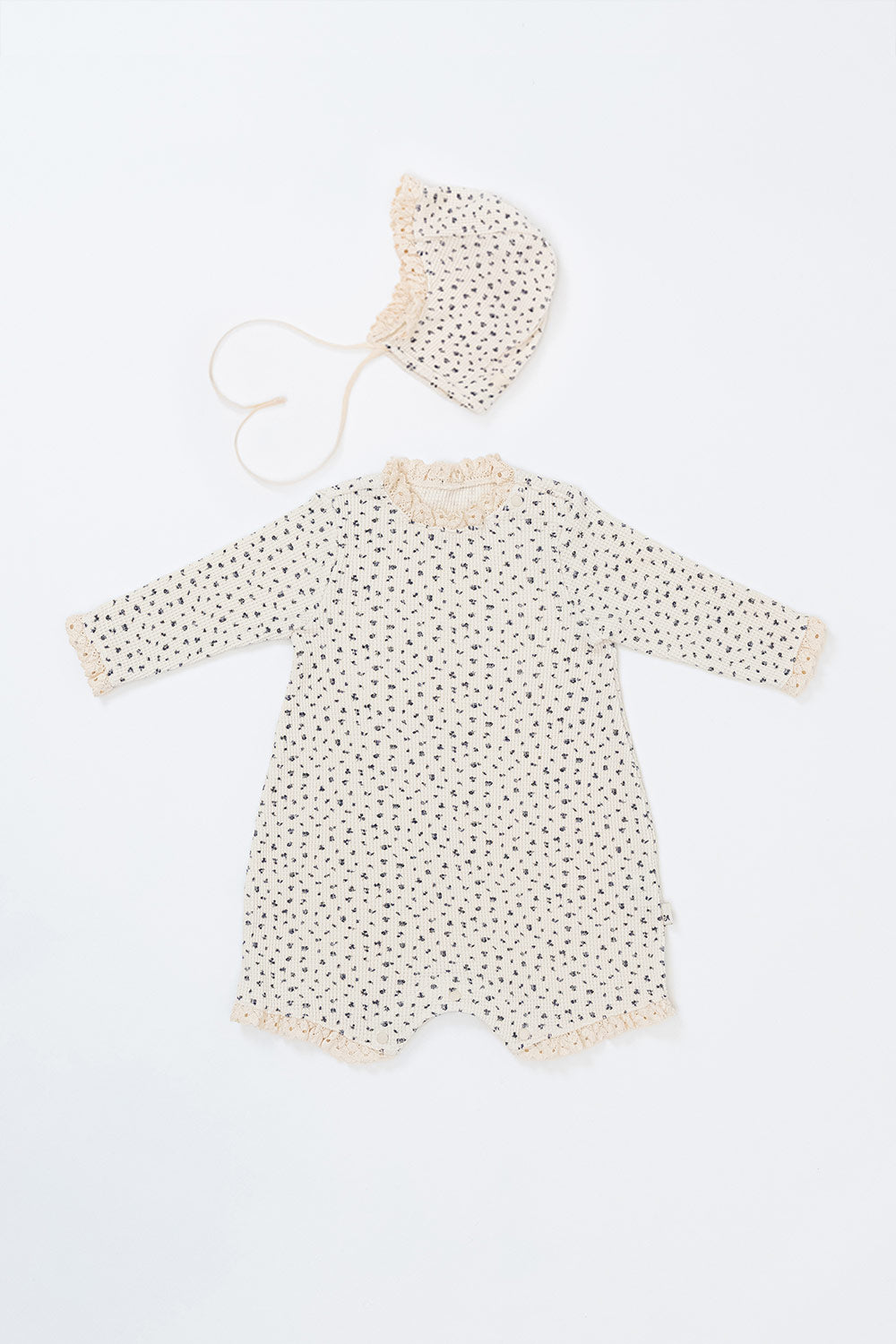 Front view of the Lumiere Bodysuit in Olive Rose – a long-sleeve baby romper with a subtle floral print and lace accents. Front view of the Lumiere Bodysuit in Olive Rose – a long-sleeve baby romper with a subtle floral print and lace accents.