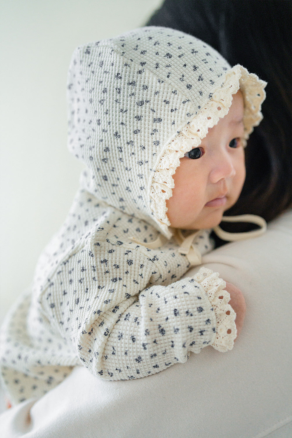 Baby lying down in the Olive Rose bodysuit – featuring a comfortable waffle knit fabric and relaxed fit for unrestricted movement. Baby lying down in the Olive Rose bodysuit – featuring a comfortable waffle knit fabric and relaxed fit for unrestricted movement.