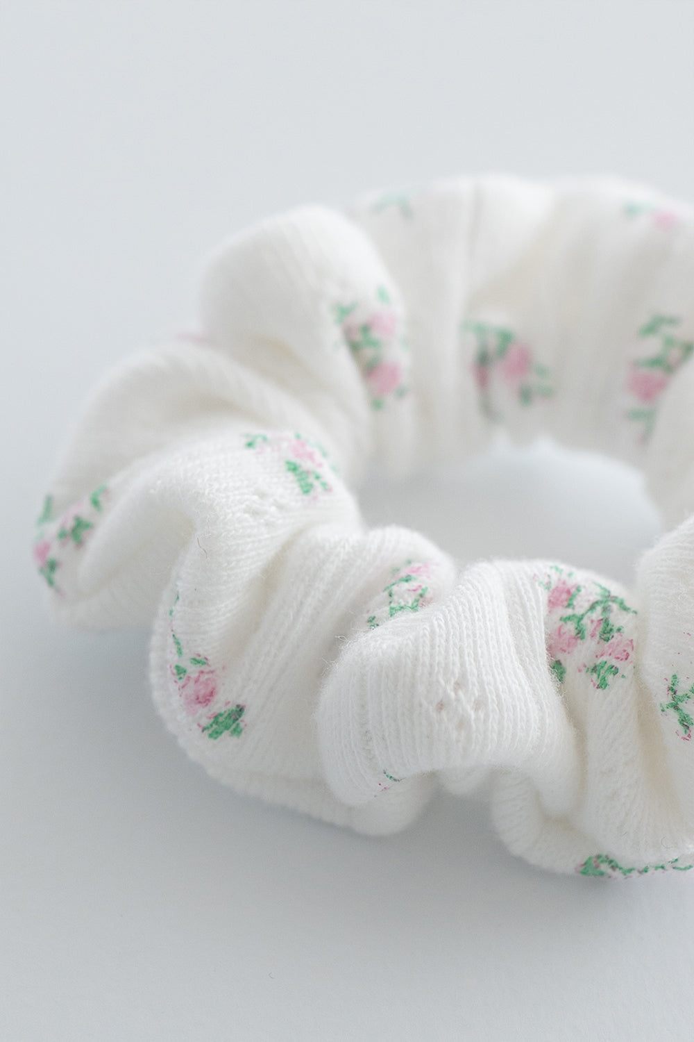 Close-up of blossom pink scrunchie with pink rose accents – Avauma
Close-up of blossom pink scrunchie with pink rose accents – Avauma