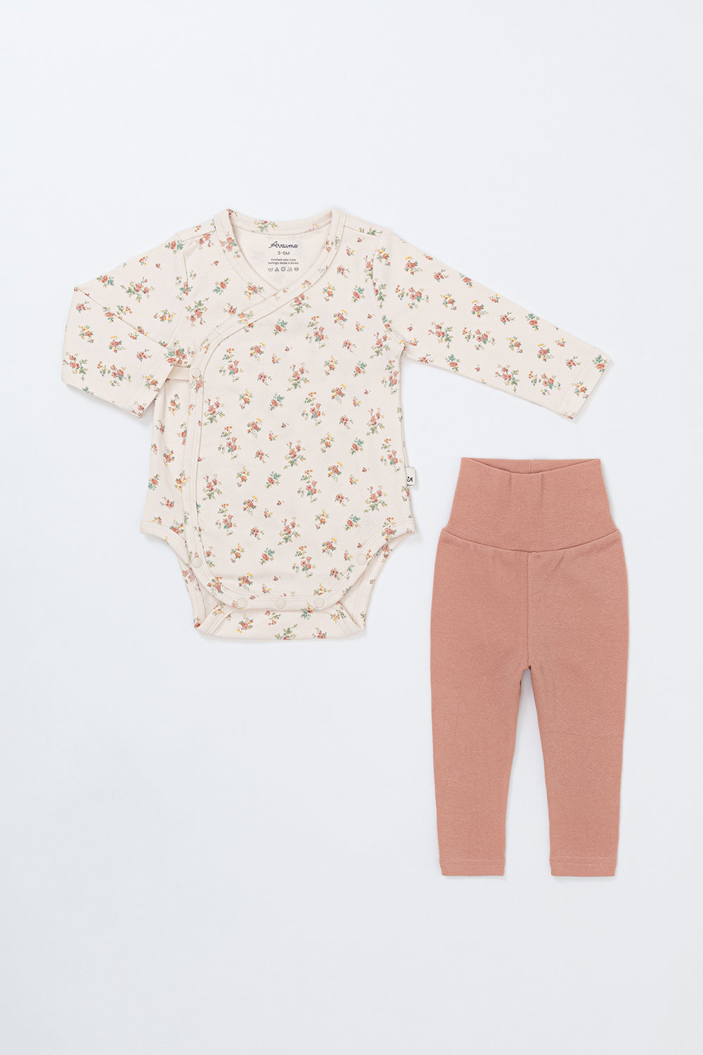 Front view of the Avauma Selina Babysuit in Cream Floral – a long-sleeve bodysuit paired with matching leggings for comfortable wear Front view of the Avauma Selina Babysuit in Cream Floral – a long-sleeve bodysuit paired with matching leggings for comfortable wear