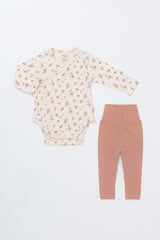 Front view of the Avauma Selina Babysuit in Cream Floral – a long-sleeve bodysuit paired with matching leggings for comfortable wear Front view of the Avauma Selina Babysuit in Cream Floral – a long-sleeve bodysuit paired with matching leggings for comfortable wear