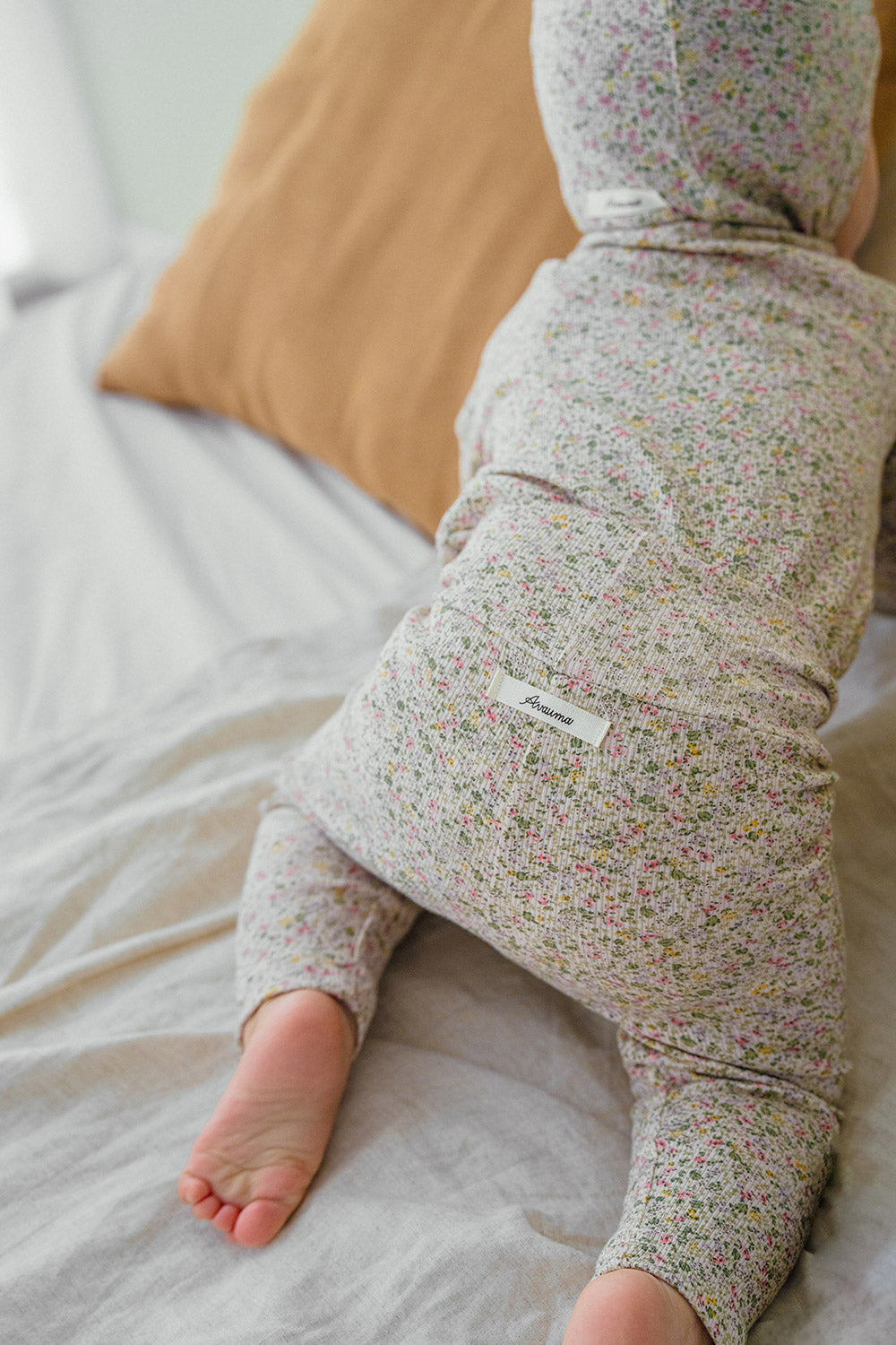 Selina Babysuit Iris back view – emphasizing secure snap closures and a comfortable fit in a modern iris hue Selina Babysuit Iris back view – emphasizing secure snap closures and a comfortable fit in a modern iris hue