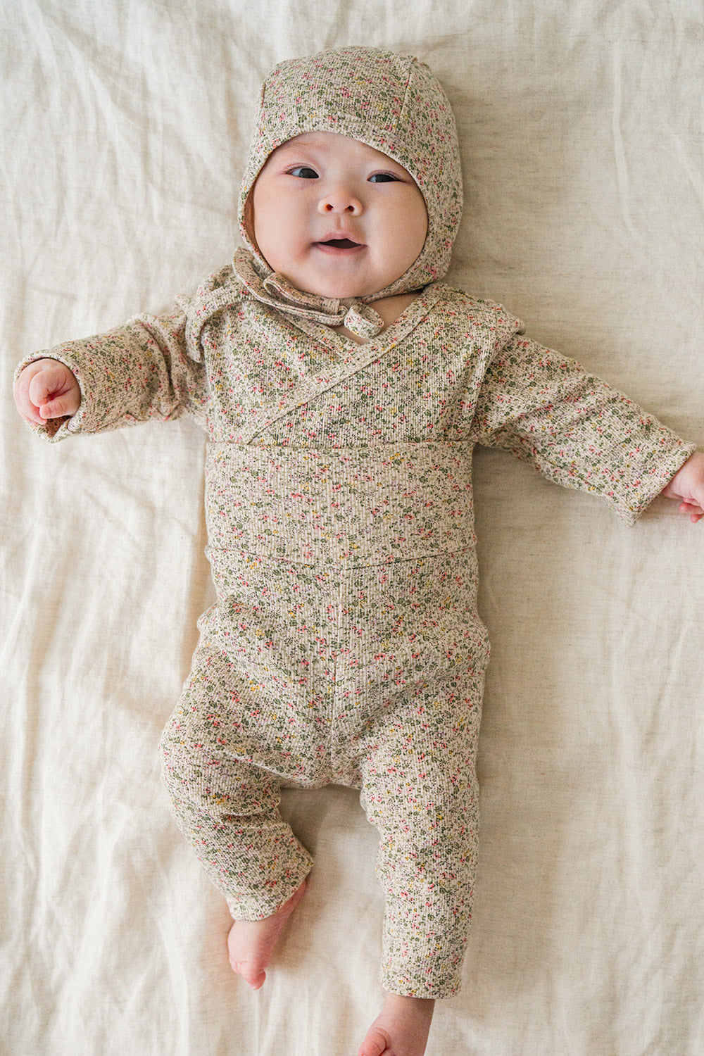 Selina Babysuit Iris detail shot – focusing on the soft fabric and secure closures designed for hassle-free diaper changes Selina Babysuit Iris detail shot – focusing on the soft fabric and secure closures designed for hassle-free diaper changes