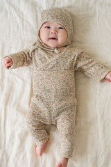 Selina Babysuit Iris detail shot – focusing on the soft fabric and secure closures designed for hassle-free diaper changes Selina Babysuit Iris detail shot – focusing on the soft fabric and secure closures designed for hassle-free diaper changes