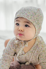 Selina Babysuit Iris close-up – detailed view of high-quality fabric texture and refined stitching for newborn wear Selina Babysuit Iris close-up – detailed view of high-quality fabric texture and refined stitching for newborn wear