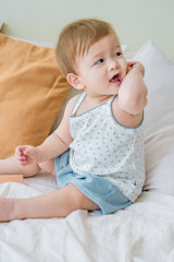 Baby boy wearing Avauma blue picot tank set – white sleeveless top with blue trim and matching blue shorts
Baby boy wearing Avauma blue picot tank set – white sleeveless top with blue trim and matching blue shorts