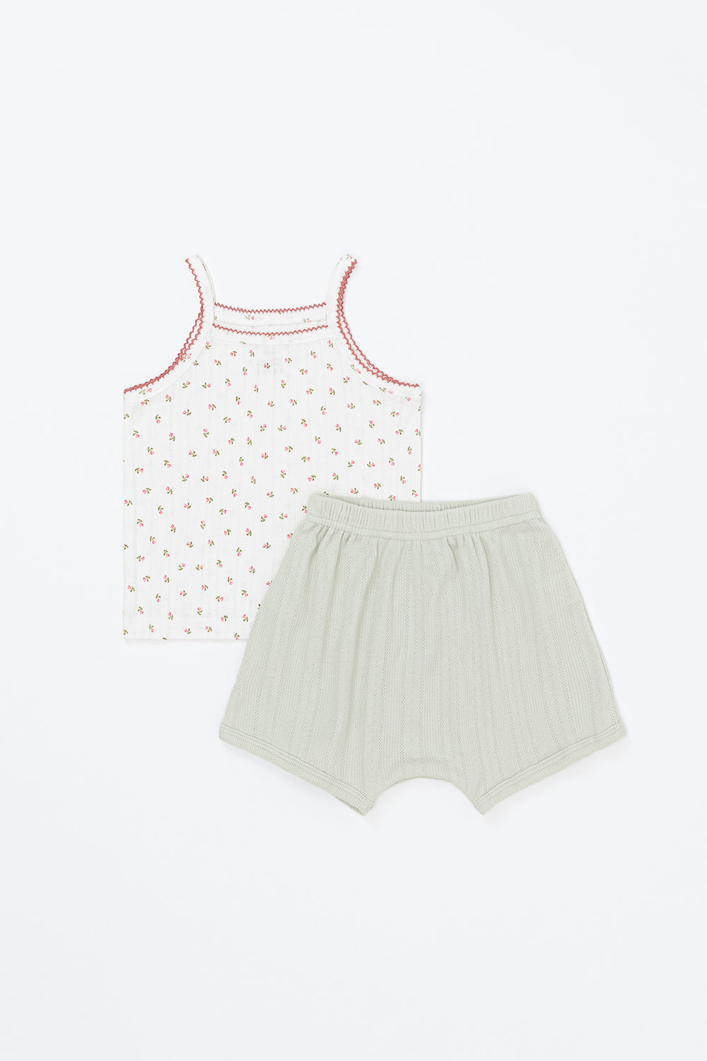 Flat lay of Avauma floppy baby tank set – floral print sleeveless top with sage green shorts
Flat lay of Avauma floppy baby tank set – floral print sleeveless top with sage green shorts