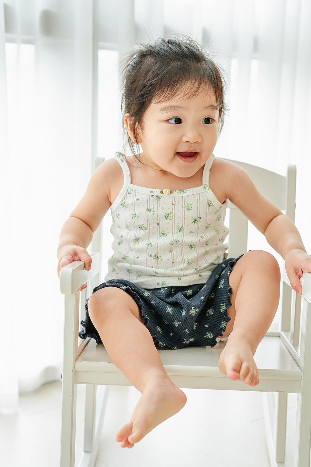 Baby wearing Avauma blue mint garden top with navy shorts – playful floral summer outfit
Baby wearing Avauma blue mint garden top with navy shorts – playful floral summer outfit