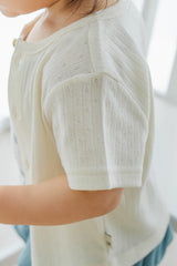 Side view of Avauma Oat Latte short-sleeve baby cardigan, showing fine airy knit texture and breathable fit.
Side view of Avauma Oat Latte short-sleeve baby cardigan, showing fine airy knit texture and breathable fit.