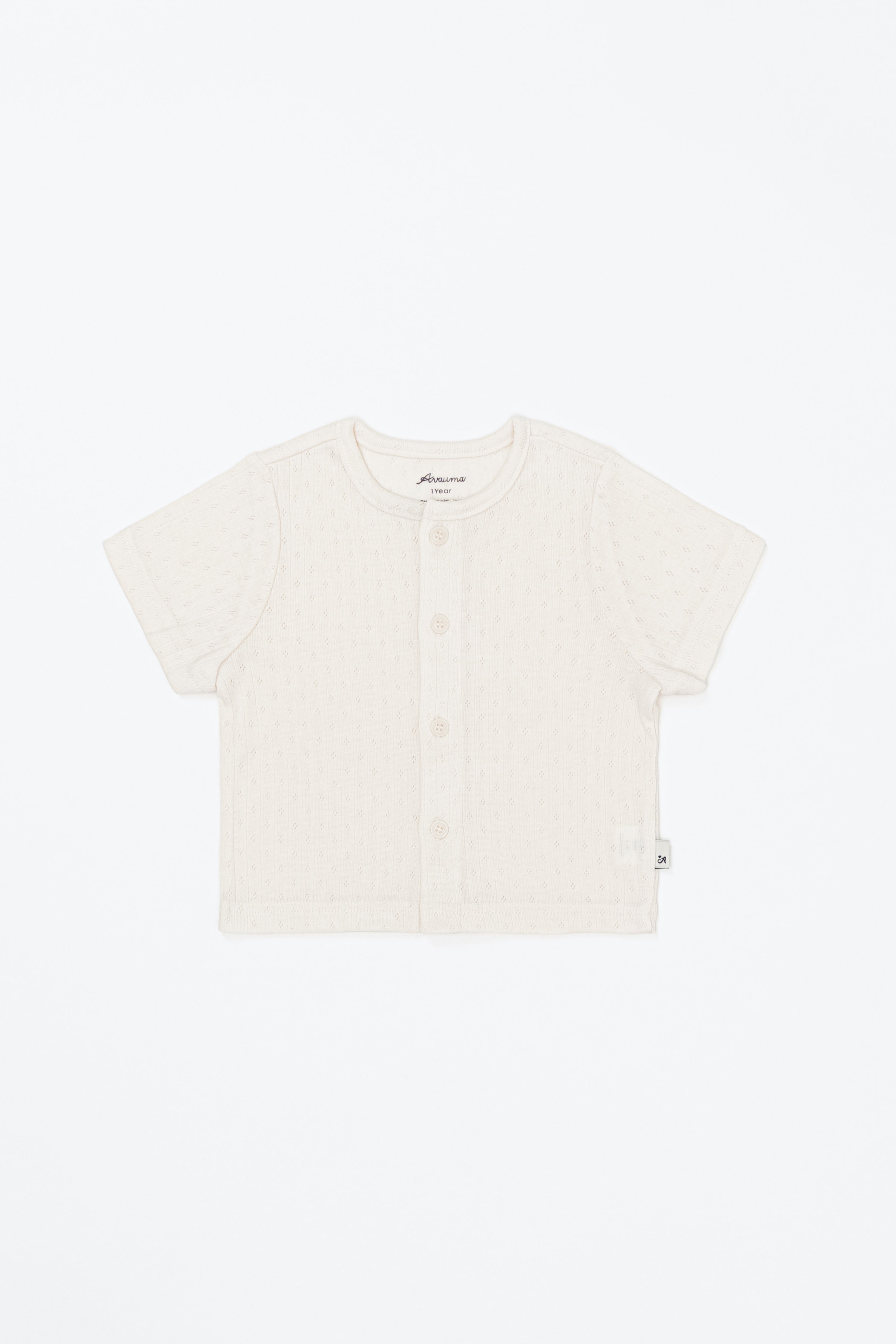 Avauma Lucent Short Sleeve Cardigan in Oat Latte color laid flat – lightweight summer knitwear for babies. Avauma Lucent Short Sleeve Cardigan in Oat Latte color laid flat – lightweight summer knitwear for babies.