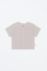 Lucent Short Sleeve Cardigan product shot. Ivory infant summer short-sleeve cardigan laid flat on a clean, light background Lucent Short Sleeve Cardigan product shot. Ivory infant summer short-sleeve cardigan laid flat on a clean, light background