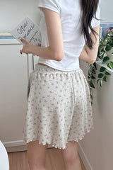 Back view of Avauma Petitbloom mom shorts in rosy cream, paired with relaxed fit top.
 Back view of Avauma Petitbloom mom shorts in rosy cream, paired with relaxed fit top.