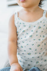Close-up of toddler wearing Avauma Blue Herb tank top showing floral print
Close-up of toddler wearing Avauma Blue Herb tank top showing floral print