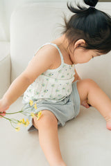 Toddler girl in Avauma Green Tea Milk shorts, sitting on sofa with yellow flower in hand
Toddler girl in Avauma Green Tea Milk shorts, sitting on sofa with yellow flower in hand