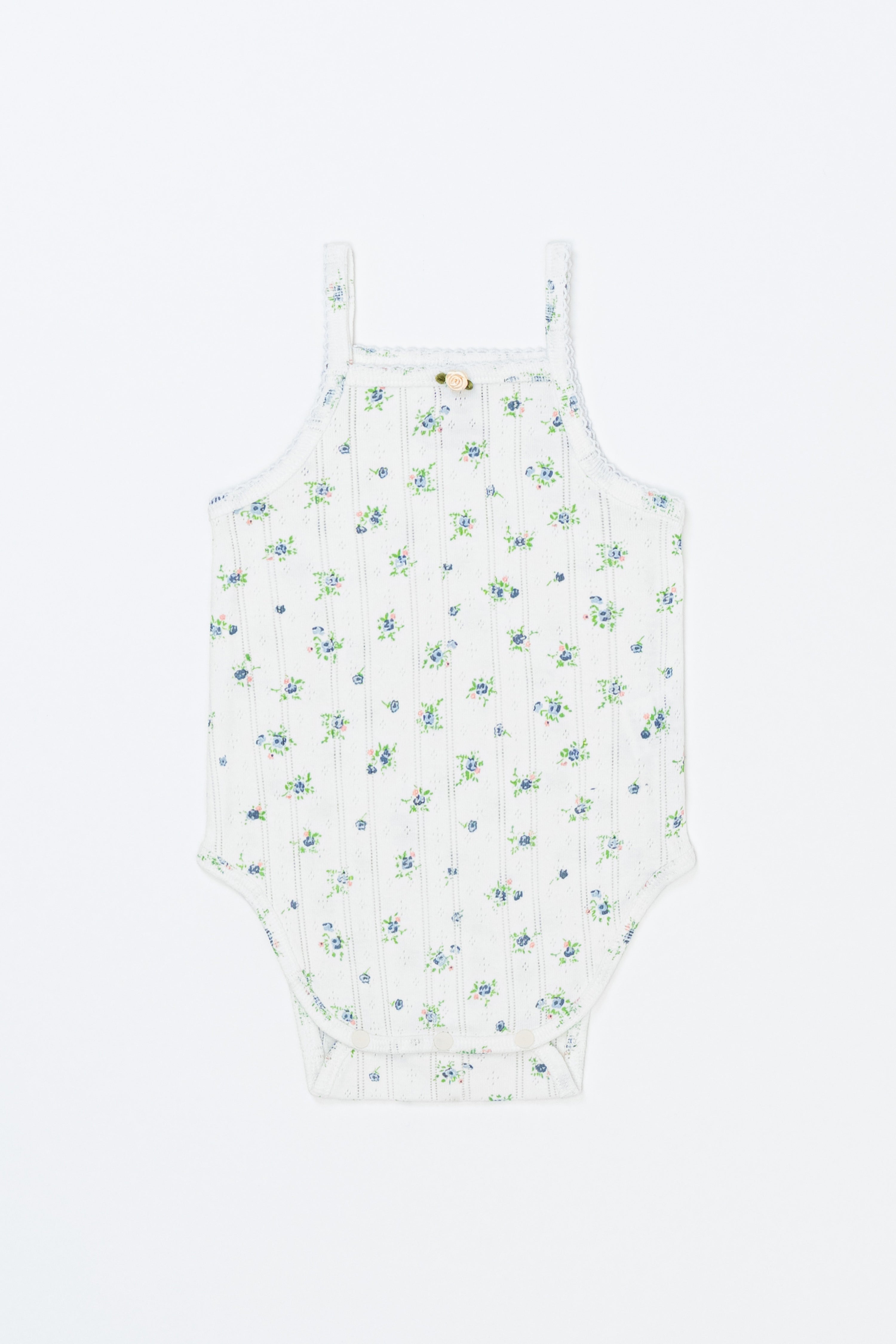 Avauma Summer Picot Sleeveless Bodysuit Blue Garden Mint product shot. White baby romper with blue and green floral print on a clean background. Avauma Summer Picot Sleeveless Bodysuit Blue Garden Mint product shot. White baby romper with blue and green floral print on a clean background.