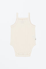 Avauma Summer Picot Sleeveless Bodysuit Buttermilk product shot. Lay-flat of white ribbed baby romper with small bow on a clean background. Avauma Summer Picot Sleeveless Bodysuit Buttermilk product shot. Lay-flat of white ribbed baby romper with small bow on a clean background.