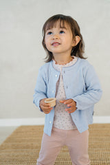 Toddler girl in Avauma Soft Berry pajama layered with a pastel blue cardigan – cozy baby girl look
 Toddler girl in Avauma Soft Berry pajama layered with a pastel blue cardigan – cozy baby girl look