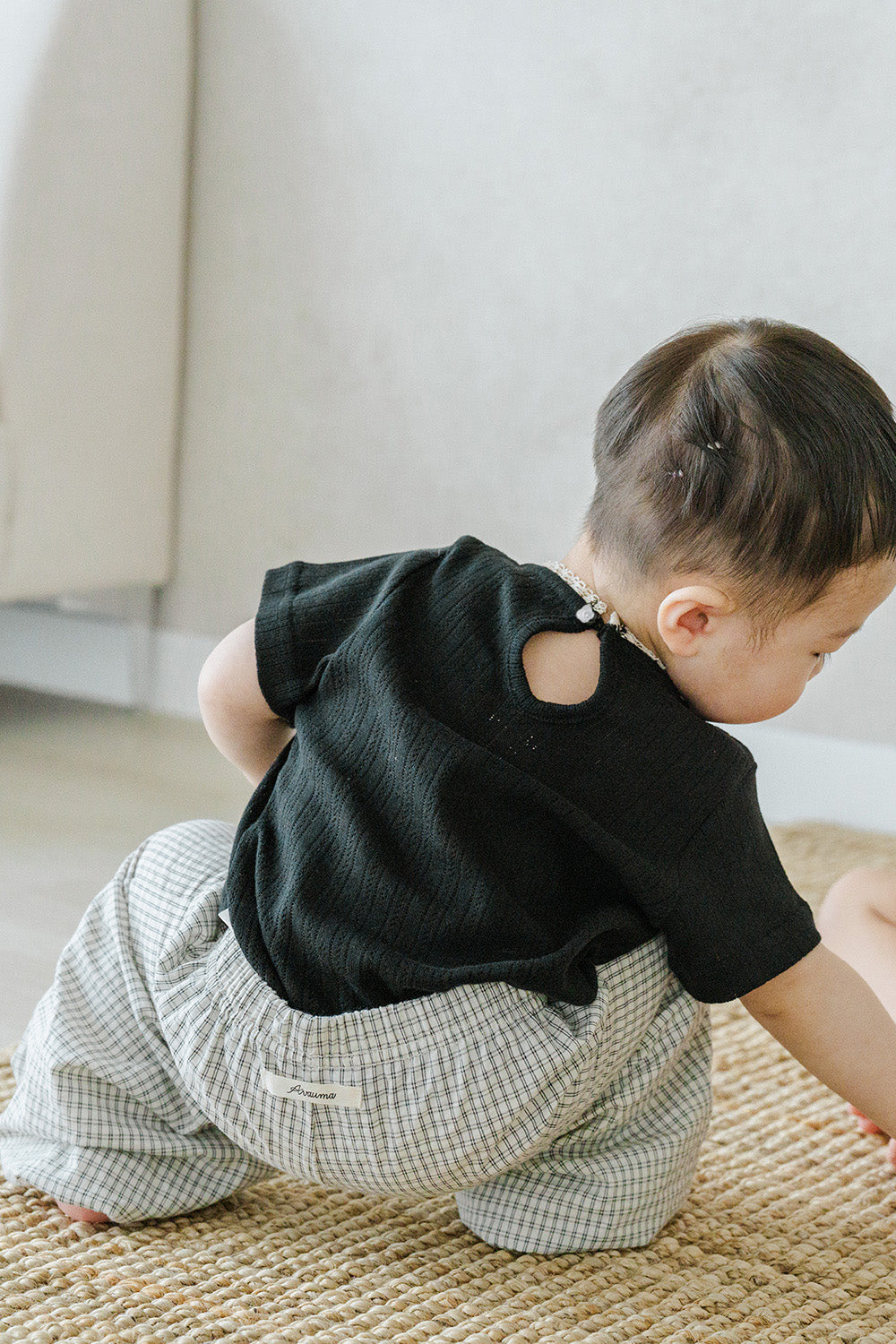 Infant crawling in Avauma Breeze Jogger Pants, vintage check pattern with comfy elastic waist. Infant crawling in Avauma Breeze Jogger Pants, vintage check pattern with comfy elastic waist.