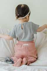 Back view of child wearing Avauma Breeze Jogger Pants in rose wood, showing elastic waistband. Back view of child wearing Avauma Breeze Jogger Pants in rose wood, showing elastic waistband.