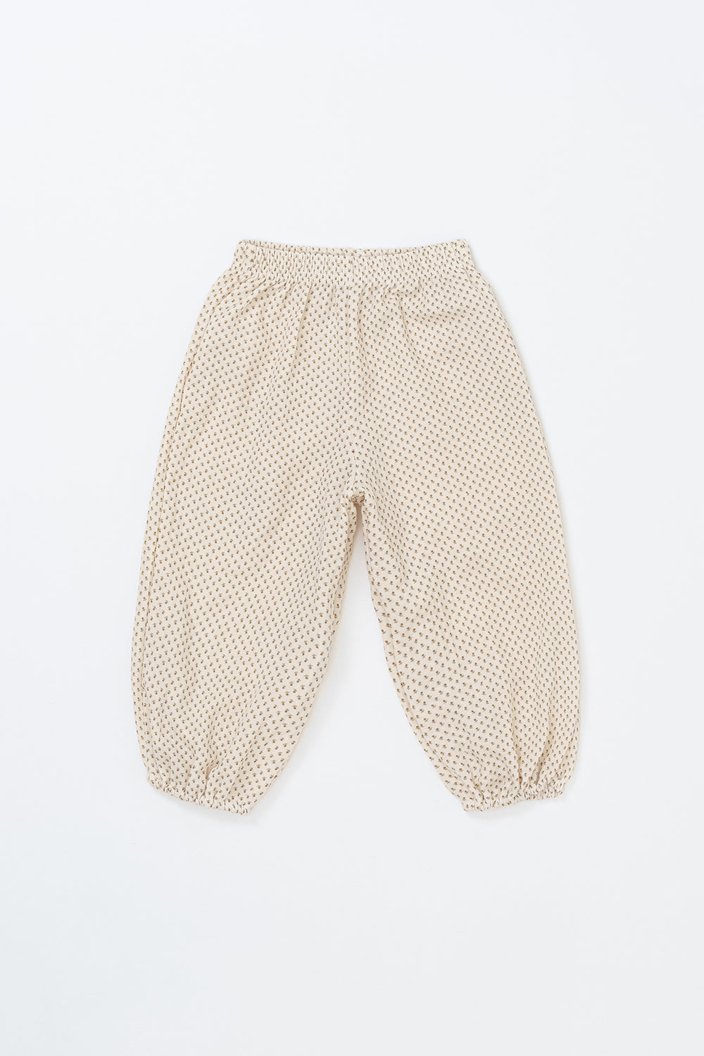 Avauma Breeze Jogger Pants in roseberry cream color, lightweight cotton pants with subtle dot pattern, flat lay view. Avauma Breeze Jogger Pants in roseberry cream color, lightweight cotton pants with subtle dot pattern, flat lay view.
