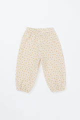 Avauma Breeze Jogger Pants in yellow flower pattern, flat lay of lightweight cotton pants with floral print. Avauma Breeze Jogger Pants in yellow flower pattern, flat lay of lightweight cotton pants with floral print.