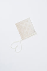 Avauma Clare Bonnet - Ivory Race, laid flat on white background to display floral embroidery and ribbon ties Avauma Clare Bonnet - Ivory Race, laid flat on white background to display floral embroidery and ribbon ties