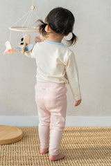 Back view of Avauma Vanilla Sky toddler girl pajama – cream and pink ribbed baby outfit Back view of Avauma Vanilla Sky toddler girl pajama – cream and pink ribbed baby outfit
