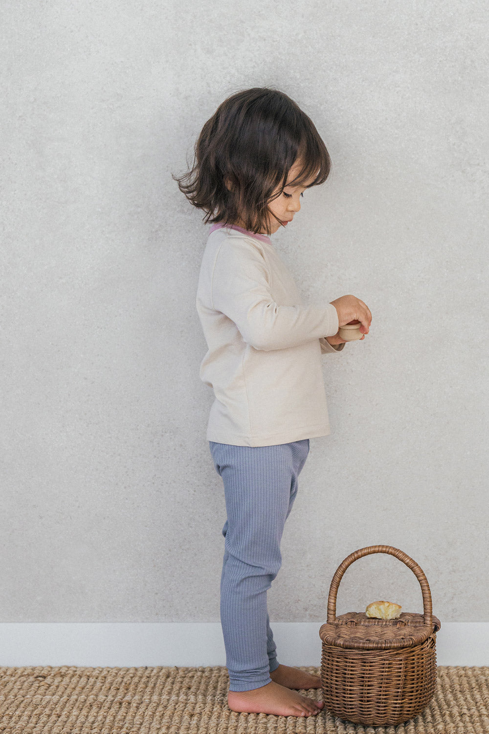 Side view of toddler girl wearing Avauma Peach Cloud baby pajama – stretchy and soft ribbed set
 Side view of toddler girl wearing Avauma Peach Cloud baby pajama – stretchy and soft ribbed set