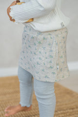 Close-up of Avauma baby girl floral skirted leggings in mint green with soft ribbed texture Close-up of Avauma baby girl floral skirted leggings in mint green with soft ribbed texture