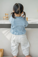 Back view of toddler in Avauma Skybloom knit baby cardigan with heart pattern, lightweight and breathable Back view of toddler in Avauma Skybloom knit baby cardigan with heart pattern, lightweight and breathable