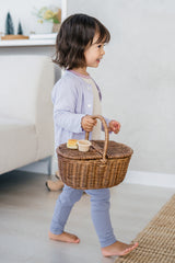 Side view of toddler wearing Avauma Haze Heart Cardigan in Soft Plume, cute and breathable knit baby cardigan for spring and fall. Side view of toddler wearing Avauma Haze Heart Cardigan in Soft Plume, cute and breathable knit baby cardigan for spring and fall.