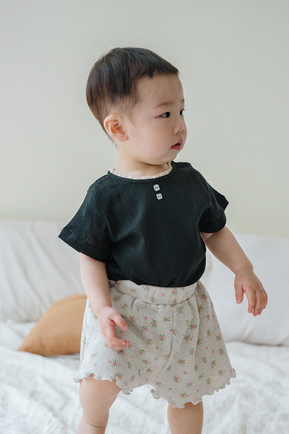 Toddler Boy Wearing Avauma Le Petite Classic Black Short Sleeve T-Shirt and Floral Shorts, Unisex Baby Outfit
 Toddler Boy Wearing Avauma Le Petite Classic Black Short Sleeve T-Shirt and Floral Shorts, Unisex Baby Outfit