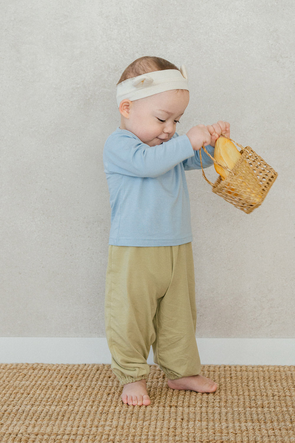 Toddler in Avauma Cloud Blue jogger outfit – pastel-colored cotton baby clothes
 Toddler in Avauma Cloud Blue jogger outfit – pastel-colored cotton baby clothes