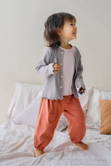 Toddler girl in Avauma Rosy Cocoa set with gray cardigan – cozy layered baby outfit
 Toddler girl in Avauma Rosy Cocoa set with gray cardigan – cozy layered baby outfit
