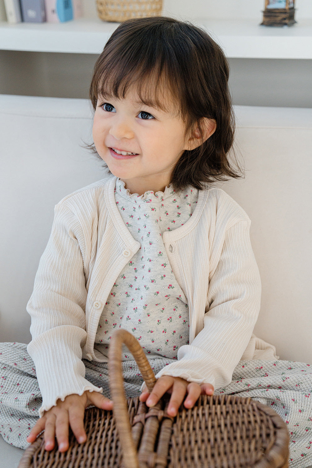 Toddler girl in Avauma Mayrose Oat pajama with a light outer layer – sweet floral baby outfit
 Toddler girl in Avauma Mayrose Oat pajama with a light outer layer – sweet floral baby outfit
