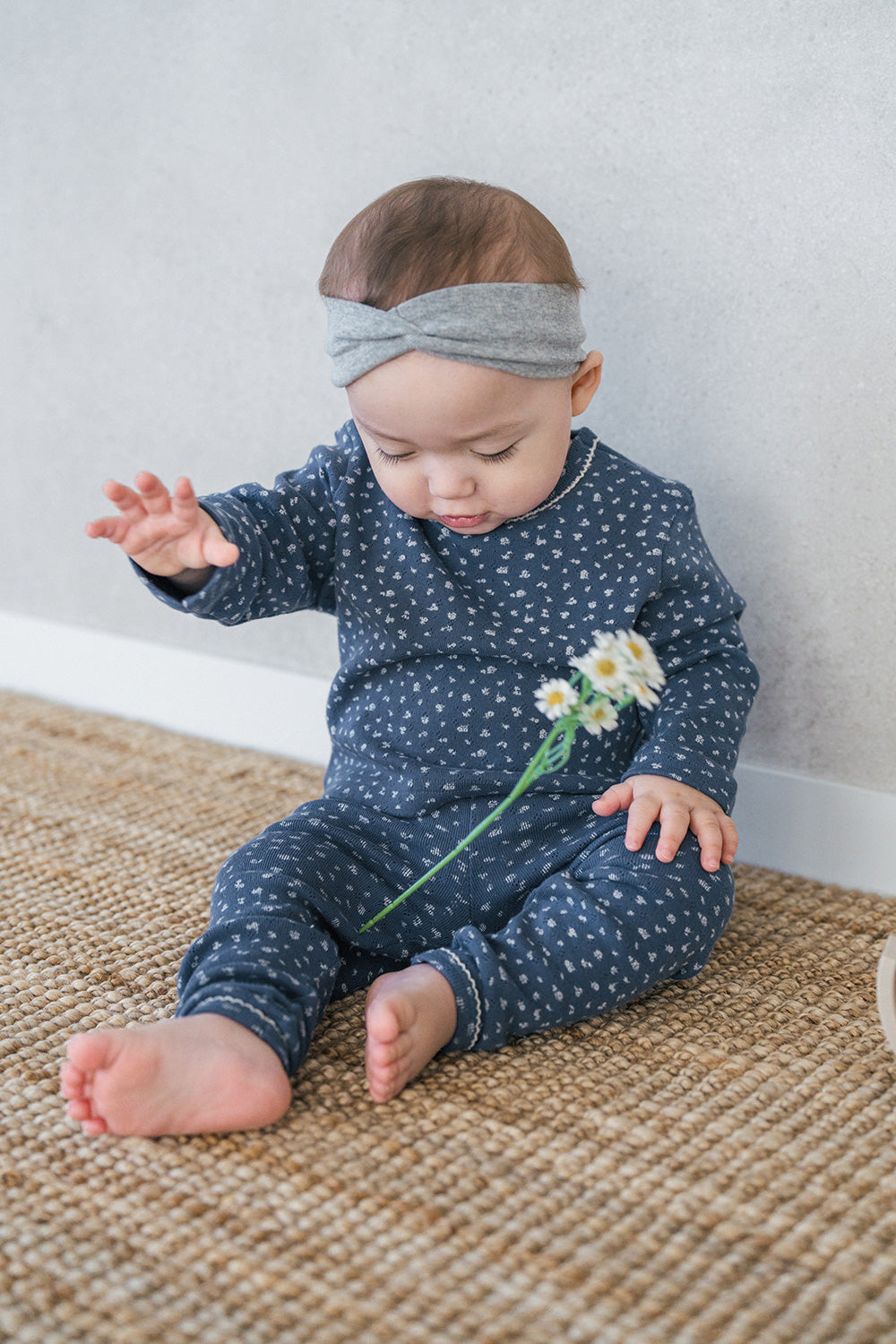 Baby girl in Avauma Ocean Fleur pajama – navy floral sleepwear for newborn and toddler girls
 Baby girl in Avauma Ocean Fleur pajama – navy floral sleepwear for newborn and toddler girls