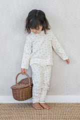 Baby girl in Avauma Sky Blossom floral pajama – cozy long sleeve top and leggings
 Baby girl in Avauma Sky Blossom floral pajama – cozy long sleeve top and leggings