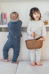 Back view of toddlers in Avauma pajamas – Ocean Fleur and Sky Blossom floral baby outfits
 Back view of toddlers in Avauma pajamas – Ocean Fleur and Sky Blossom floral baby outfits