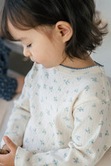 Close-up of Avauma Sky Blossom pajama – soft cream fabric with delicate floral print
 Close-up of Avauma Sky Blossom pajama – soft cream fabric with delicate floral print