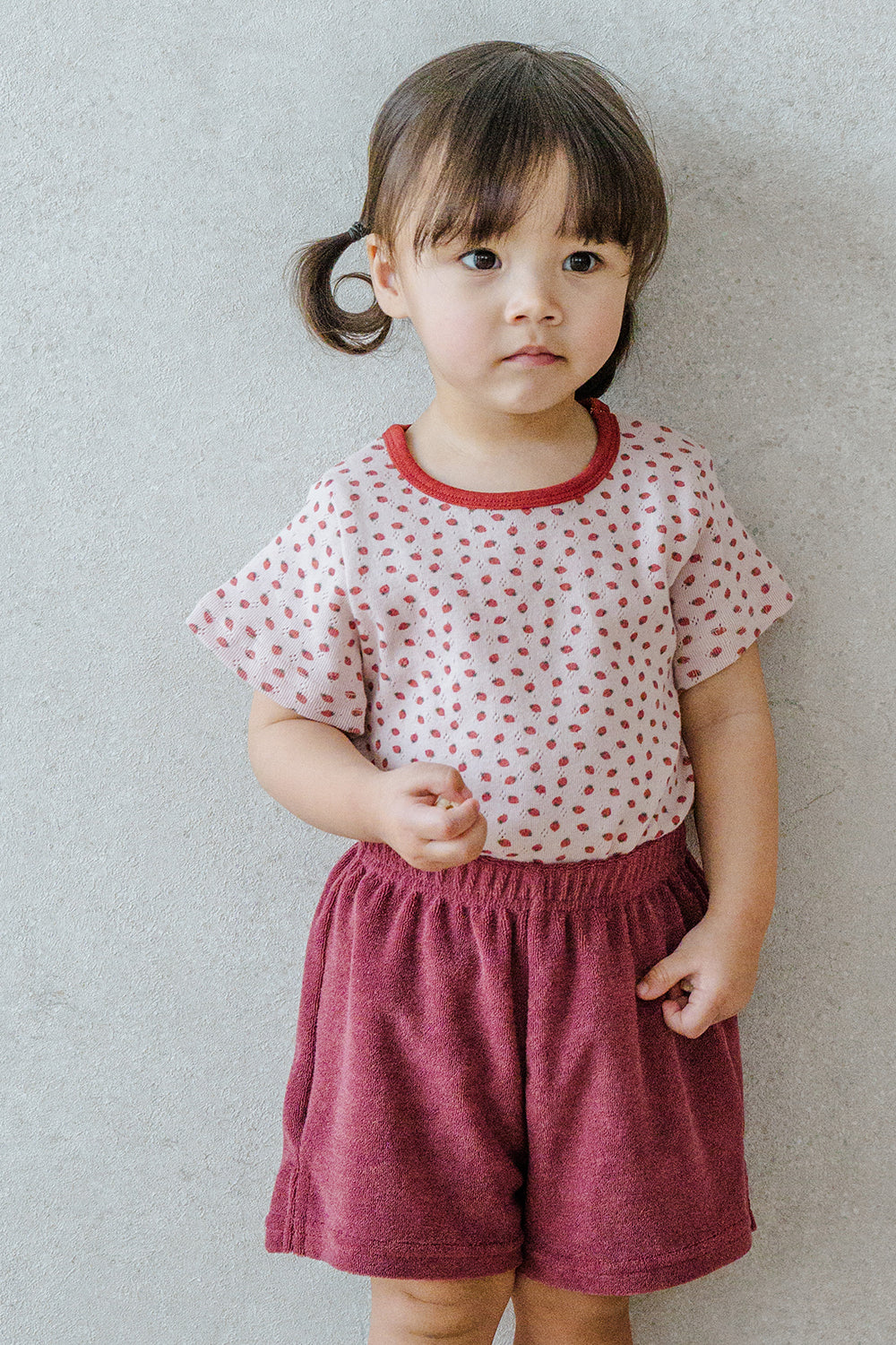 Toddler Girl Standing in Avauma Mellow Pop Setup Deep Berry, Soft and Adorable Baby Clothing Set Toddler Girl Standing in Avauma Mellow Pop Setup Deep Berry, Soft and Adorable Baby Clothing Set