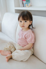 Close-up of Avauma Merry Purp Cotton Pink Top with Delicate Ribbon Detail, Soft Baby Girl Fashion
Close-up of Avauma Merry Purp Cotton Pink Top with Delicate Ribbon Detail, Soft Baby Girl Fashion