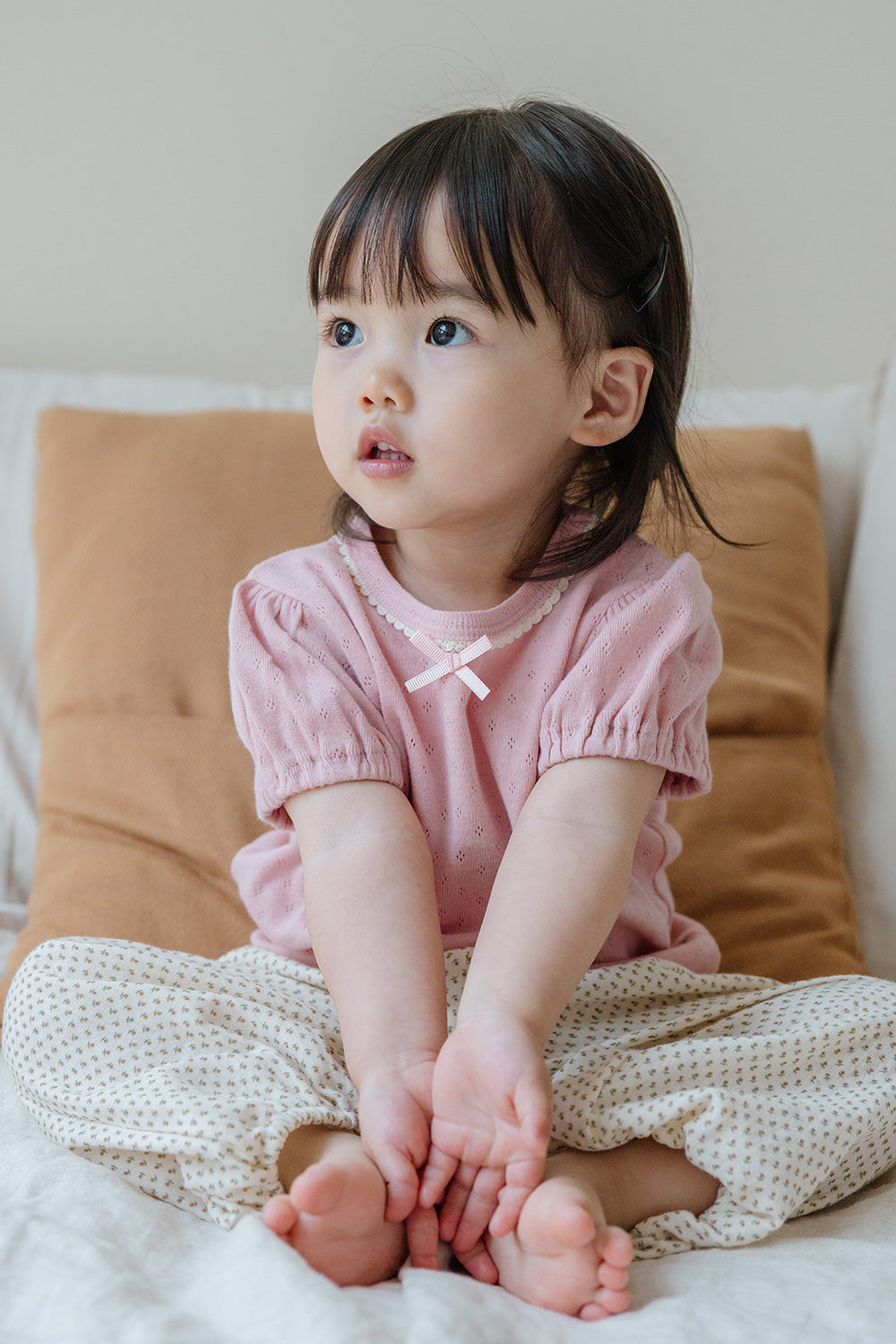 Cute Toddler Sitting on Sofa in Avauma Merry Purp Cotton Pink, Comfortable and Stylish Outfit
Cute Toddler Sitting on Sofa in Avauma Merry Purp Cotton Pink, Comfortable and Stylish Outfit